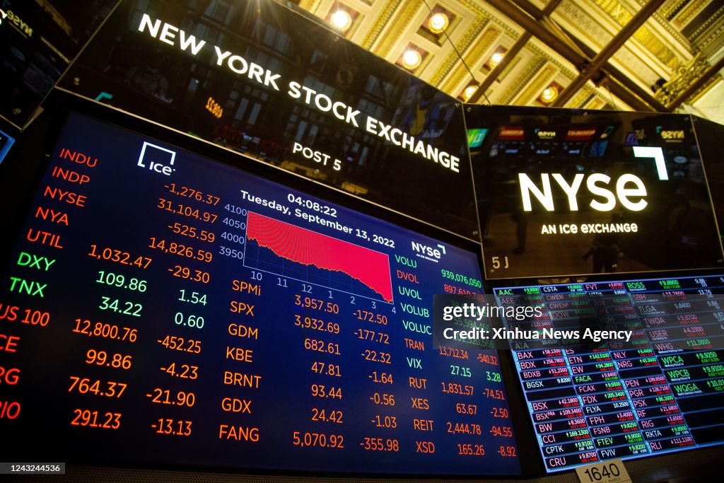 A monitor displays stock market information at the New York Stock