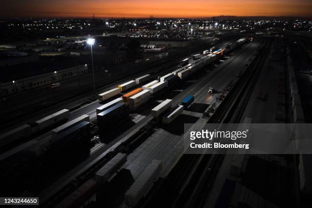Semi truck drives past shipping containers at the BNSF Railway Hobart Yard rail terminal in Vernon, California, US on Wednesday, Sept. 14, 2022....
