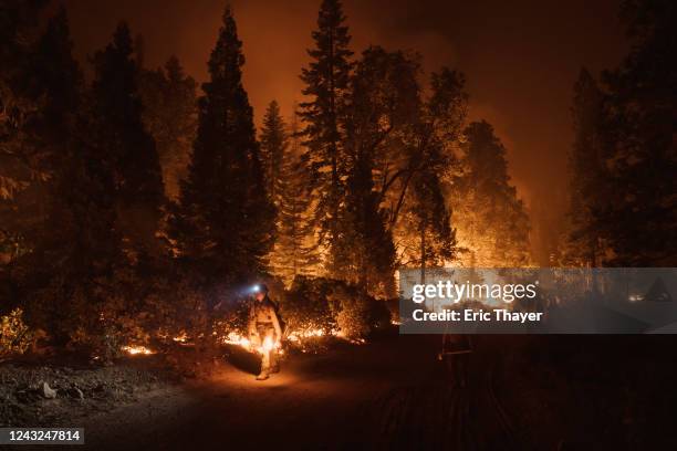 Firefighters light a controlled burn during the Mosquito Fire on September 14, 2022 in Foresthill, California. The Mosquito fire has became...