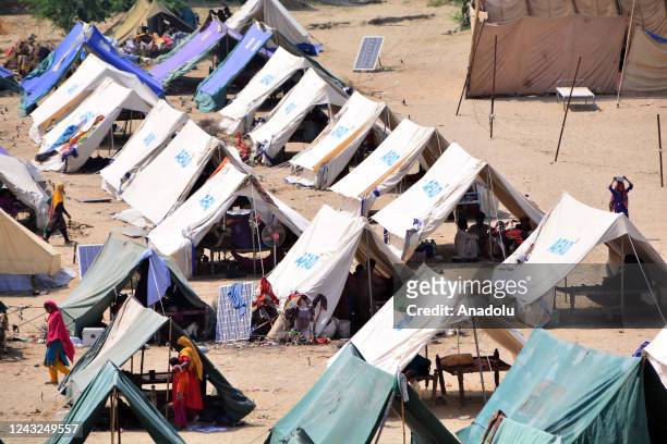 Pakistani flood victims are seen in a tent provided by Turkish Disaster and Emergency Management Presidency in Sehwan Sharif, southern Sindh...