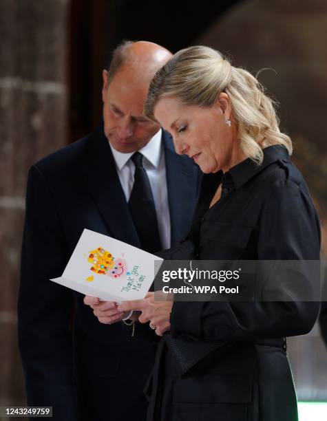 Prince Edward, Earl of Wessex and Sophie, Countess of Wessex view cards and floral tributes in Manchester Cathedral following the death of Queen...