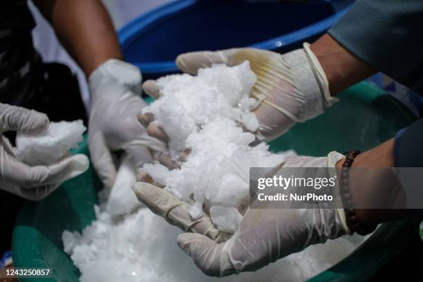 The Indonesian Navy is seen destroying evidence of methamphetamine weighing 23.98 Kilograms using a blender after being mixed with water and oil,...