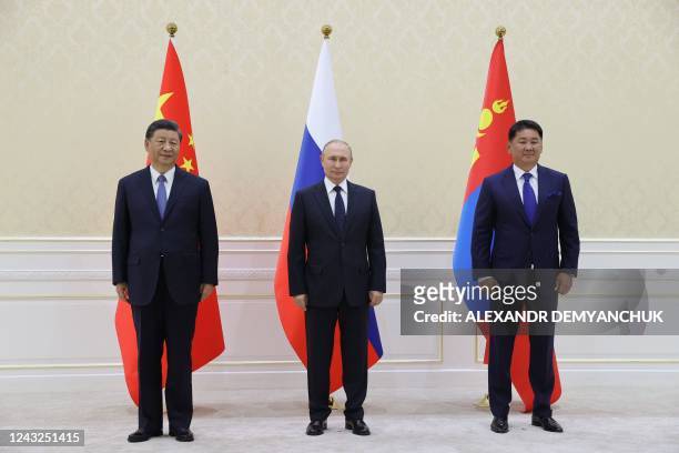 China's President Xi Jinping, Russian President Vladimir Putin and Mongolia's President Ukhnaa Khurelsukh hold a trilateral meeting on the sidelines...