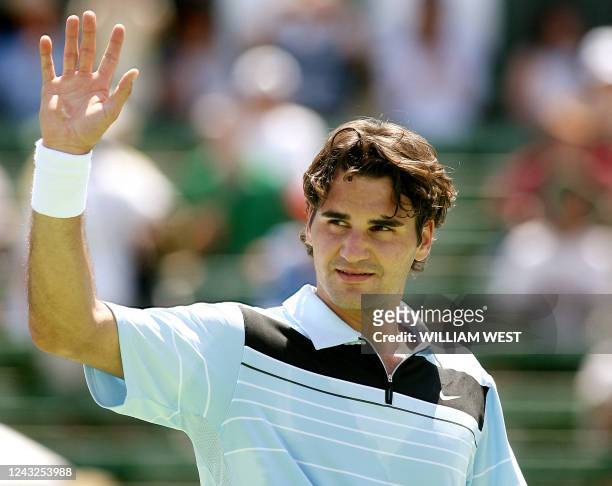 Roger Federer of Switzerland waves to the crowds after his 7-6, 6-7, 7-6 victory over Radek Stepanek of Croatia at the Kooyong Classic, in Melbourne...