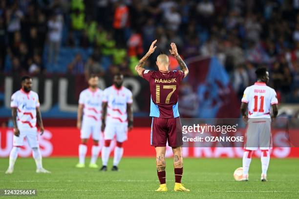 Trabzonspor's Slovak midfielder Marek Hamsik celebrates scoring his team's first goal during the UEFA Europa League group H football match between...