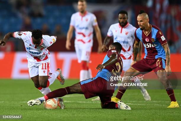 Crvena Zvezda Beograd's Ghana's forward Osman Bukari fights for the ball with Trabzonspor's Dutch defender Stefano Denswil during the UEFA Europa...