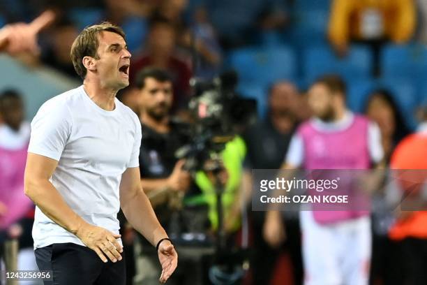 Crvena Zvezda Beograd's Serbia's coach Milos Milojevic cheers for his team during the UEFA Europa League group H football match between Trabzonspor...