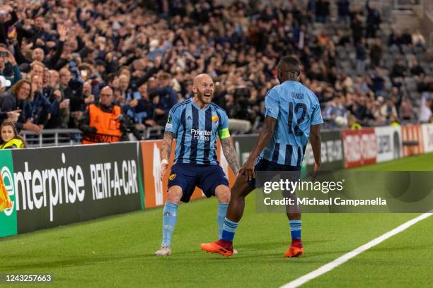 Emmanuel Banda of Djurgardens IF celebrates scoring the 2-1 with teammate Magnus Eriksson goal during the UEFA Europa Conference League group F match...