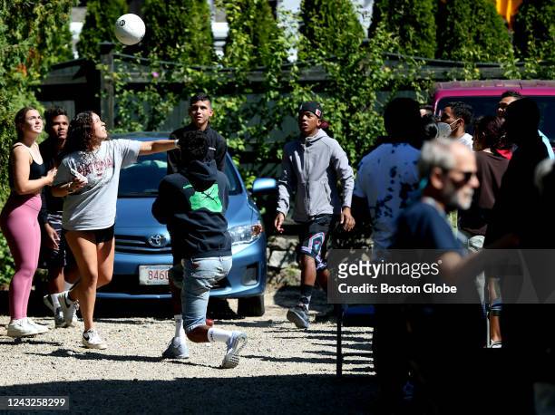 Martha's Vineyard, MA Volunteers and migrants tossed a soccer ball around at the St. Andrew's Parrish House in Edgartown, where migrants were being...