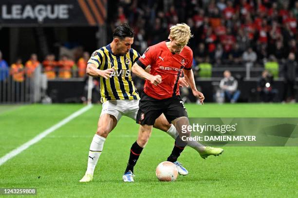 Rennes' Norwegian defender Birger Meling fights for the ball with Fenerbahce's Turkish midfielder Irfan Kahveci during the UEFA Europa League Group B...
