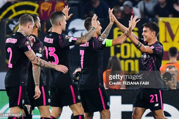 Roma's Argentinian forward Paulo Dybala celebrates after opening the scoring during the UEFA Europa League Group C group stage football match between...