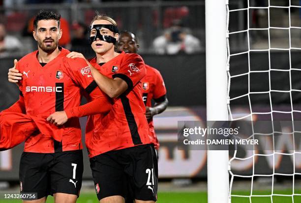 Rennes' French forward Martin Terrier celebrates with Rennes' Croatian midfielder Lovro Majer after he scored the first goal for his team during the...