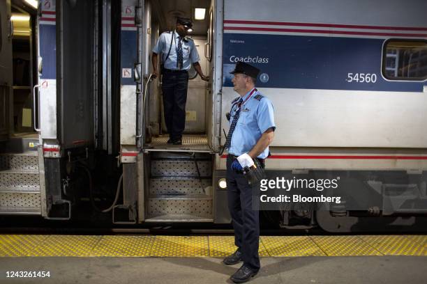 Train conductors prepare an Amtrak train for departure at Union Station in Chicago, Illinois, US, on Thursday, Sept. 15, 2022. President Joe...