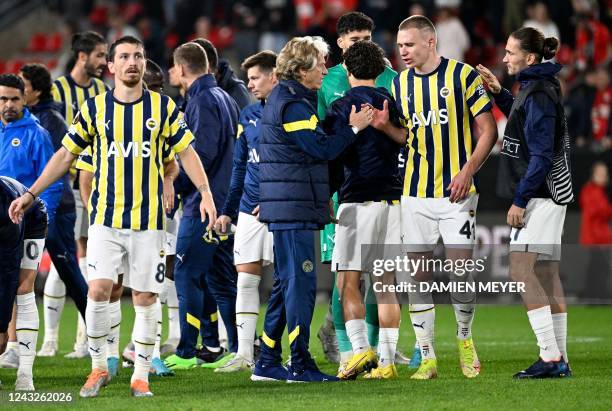 Fenerbahce's Portuguese head coach Jorge Jesus stands on the pitch with his players at the end of the UEFA Europa League Group B group stage football...