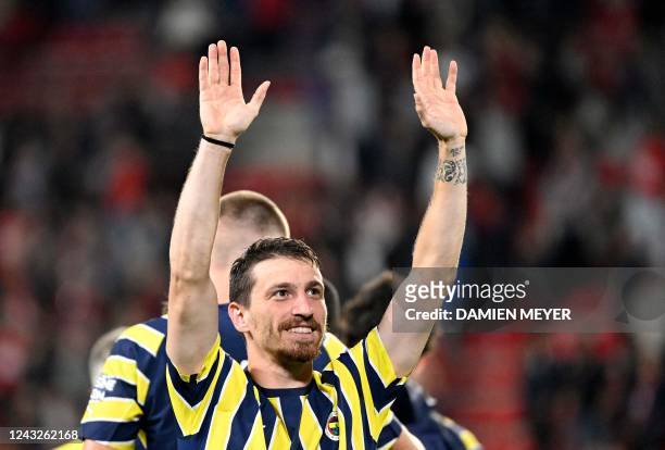 Fenerbahce's Turkish midfielder Mert Hakan Yandas waves on the pitch at the end of the UEFA Europa League Group B group stage football match between...