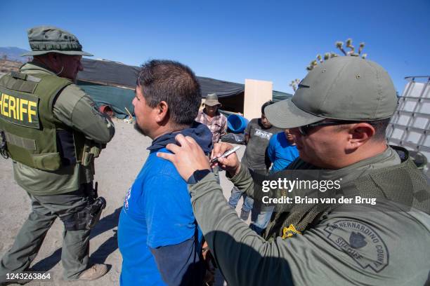 June 10, 2022: A San Bernardino County Sheriff's deputy uses a Sharpie to write the name of the apprehending officer who caught a worker after he ran...