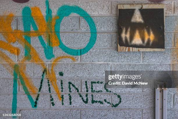 Graffiti opposing mines on the reservation is seen in an abandoned building on September 12, 2022 on the Navajo Nation west of Tuba City, Arizona....