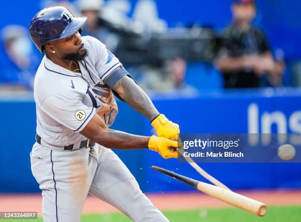 Randy Arozarena of the Tampa Bay Rays hits a broken bat RBI single against the Toronto Blue Jays in the ninth inning during their MLB game at the...