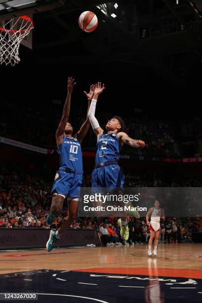 Courtney Williams of the Connecticut Sun and Natisha Hiedeman of the Connecticut Sun reach for the rebound during Game 3 of the 2022 WNBA Finals on...