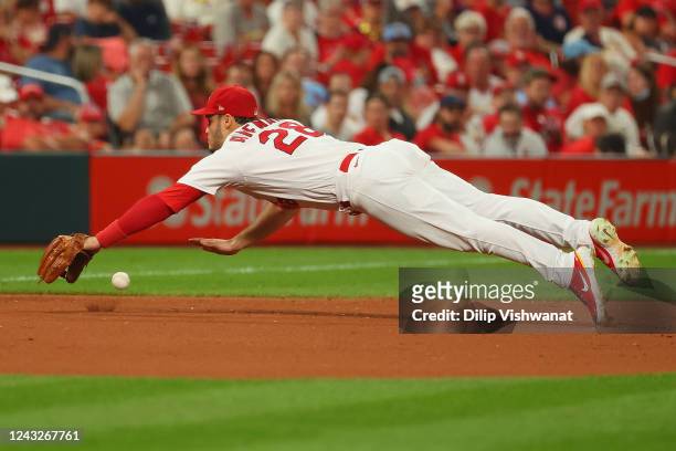Nolan Arenado of the St. Louis Cardinals dives for a ground ball against the Cincinnati Reds in the eighth inning at Busch Stadium on September 15,...