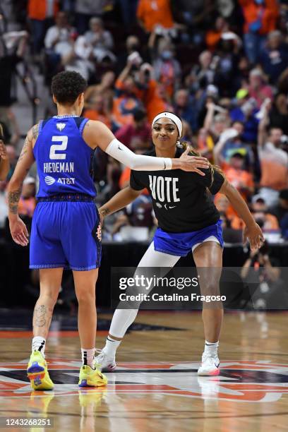 DiJonai Carrington of the Connecticut Sun high fives Natisha Hiedeman of the Connecticut Sun during Game 3 of the 2022 WNBA Finals against the Las...