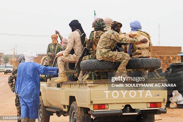Fighters for Coordination of Azawad Movements patrol through town during the Congress for the Fusion of Movements in Kidal on August 28, 2022. One of...