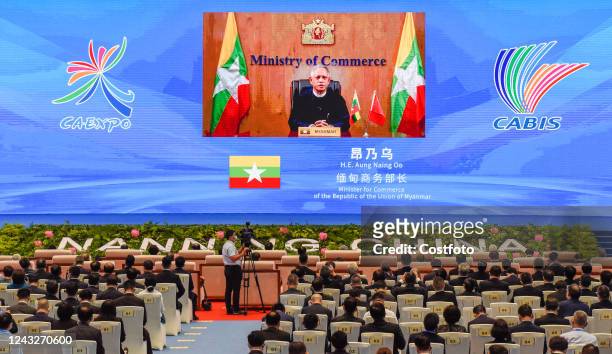 Myanmar's Minister of Commerce Aung Nae Oo delivers a video address at the opening conference of the 19th China-Asean Expo in Nanning, Guangxi,...