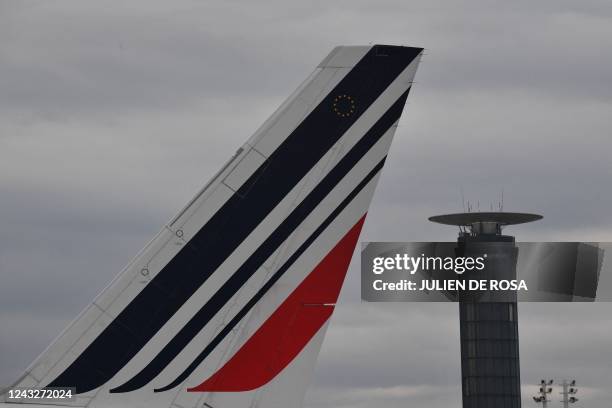 This photograph taken on September 16 shows the tail of an Air France airplane and an air traffic control tower at the Roissy-Charles de Gaulle...