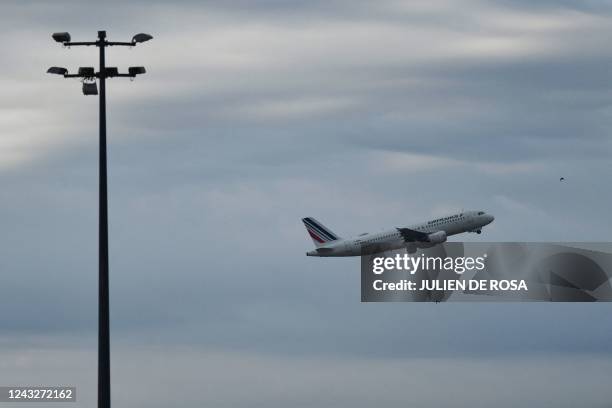 This photograph taken on September 16 shows an Air France airplane flying off the Roissy-Charles de Gaulle airport, in the northeastern outskirts of...