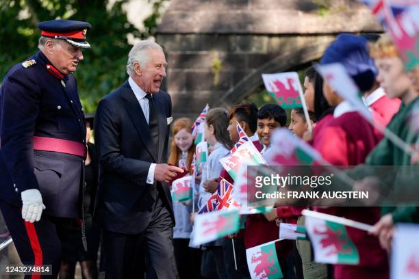 Britain's King Charles III interacts with members of the public as he leaves after attending a Service of Prayer and Reflection for the life of Queen...