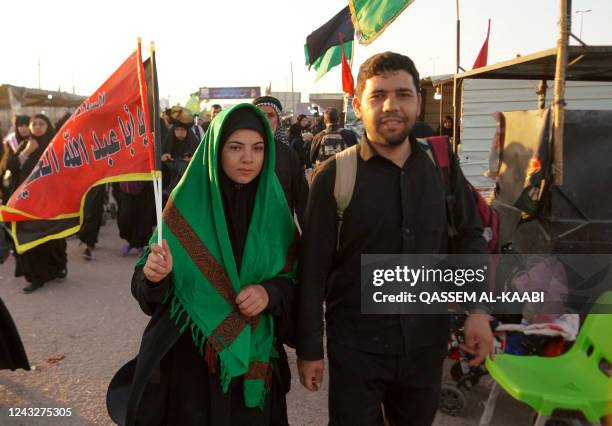 Shiite Muslim pilgrims march towards Iraq's holy city of Karbala to attend the Arbaeen religious commemoration on September 16, 2022 in the central...