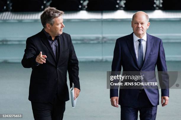 German Minister of Economics and Climate Protection and Vice-Chancellor Robert Habeck and German Chancellor Olaf Scholz arrive to address a press...