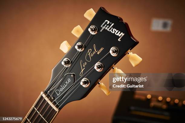 Detail of the headstock and tuners on a Gibson Les Paul 70s Deluxe electric guitar with a 70s Cherry Sunburst finish, taken on July 22, 2021.