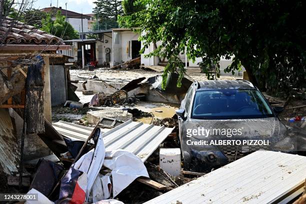 Photograh shows a flooded street following an overnight rain bomb in Pianello di Ostra, Ancona province, on September 16, 2022. - At least ten people...