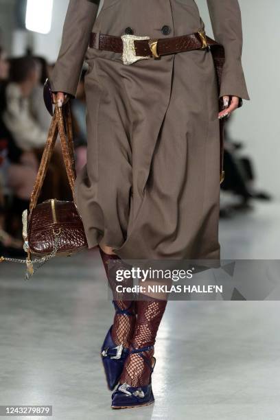 Models present creations by British designer Poster Girl during a catwalk show on the second day of London Fashion Week June Edition in London on...