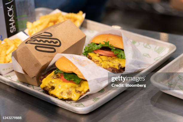 Burgers and fries at a Shake Shack restaurant during a Bloomberg Television interview in New York, U.S., on Tuesday, July 12, 2022. After a massive...