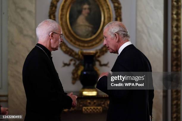 King Charles III speaks to Archbishop of Canterbury, the Most Reverend Justin Welby as he meets with faith leaders during a reception at Buckingham...