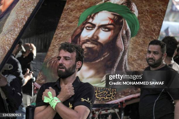 Shiite Muslim devotees gather in Iraq's central holy shrine city of Karbala on September 16, 2022 on the eve of Arbaeen , marking 40 days after the...