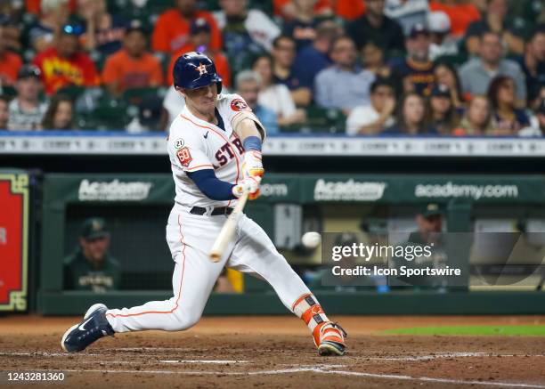 Houston Astros third baseman Alex Bregman hits a grounder in the bottom of the third inning during the MLB game between the Oakland Athletics and...