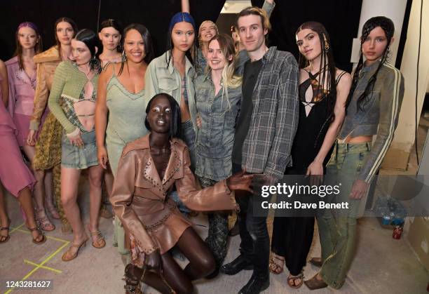 Designers Charlotte Knowles and Alex Arsenault pose with models at the KNWLS show during London Fashion Week September 2022 at The Mills Fabrica on...