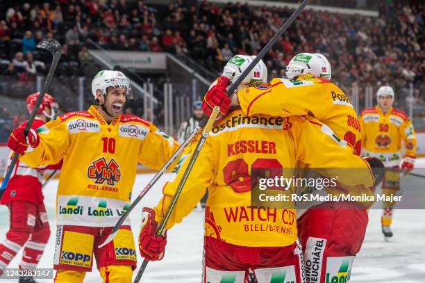 Tino Kessler of EHC Biel celebrates his goal with Damien Brunner of EHC Biel and Luca Cunti of EHC Biel during the Swiss National League game between...