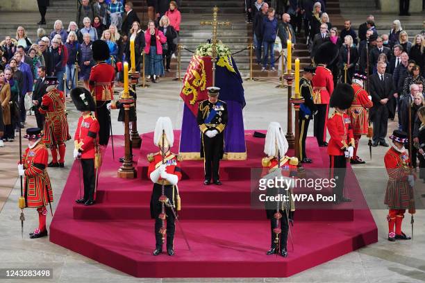 King Charles III, Anne, Princess Royal, Prince Andrew, Duke of York and Edward, Earl of Wessex hold a vigil beside the coffin of their mother, Queen...