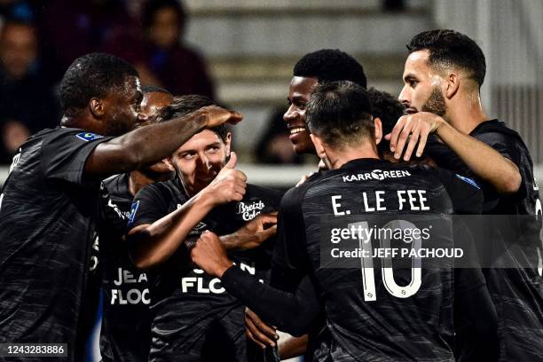 Lorients Burkinabe forward Dango Ouattara celebrates with his teammates after scoring a goal during the French L1 football match between AJ Auxerre...