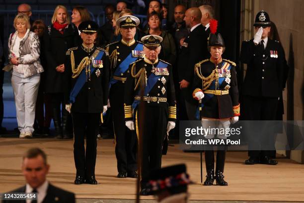 King Charles III, Anne, Princess Royal, Prince Andrew, Duke of York and Prince Edward, Earl of Wessex arrive hold a vigil beside the coffin of their...