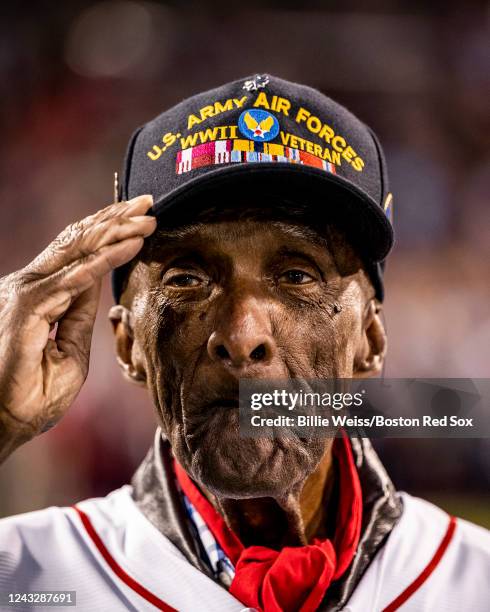 Colonel Enoch ODell Woodhouse, a retired colonel who served with the Tuskegee Airmen, looks on after throwing out a ceremonial first pitch during a...
