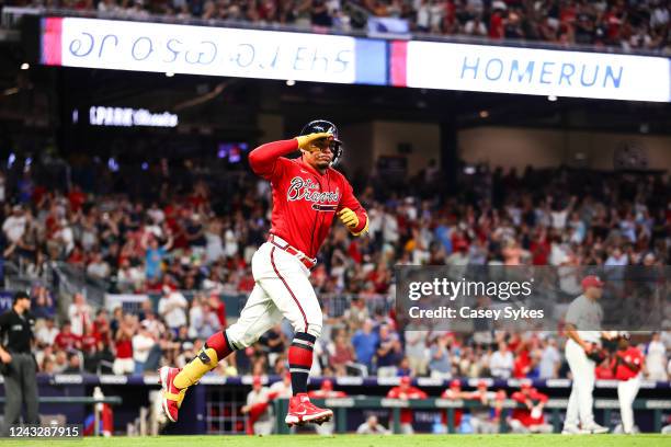 William Contreras of the Atlanta Braves salutes the dugout after hitting a solo home run in the fourth inning of a game against the Philadelphia...