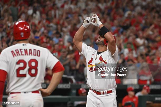 Albert Pujols of the St. Louis Cardinals reacts after hitting a two-run home run against the Cincinnati Reds in the sixth inning at Busch Stadium on...