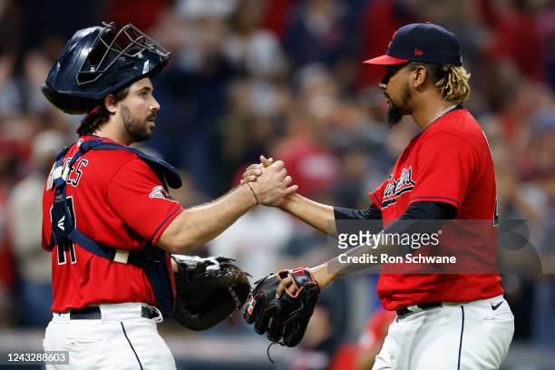 Emmanuel Clase of the Cleveland Guardians and Austin Hedges celebrate a 4-3 win against the Minnesota Twins at Progressive Field on September 16,...