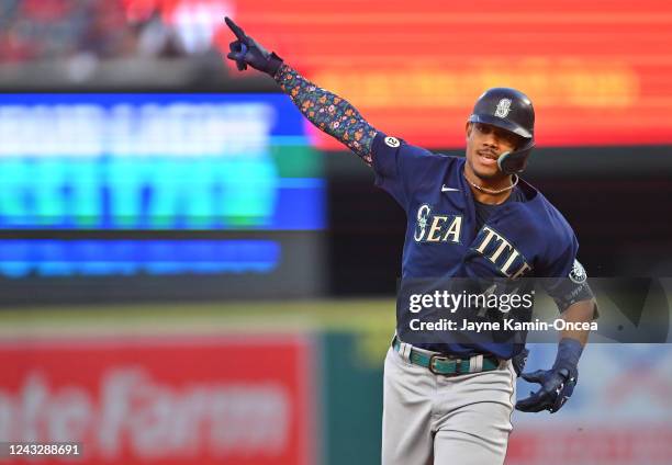 Julio Rodriguez of the Seattle Mariners rounds the bases after hitting a solo home run in the first inning against the Los Angeles Angels at Angel...