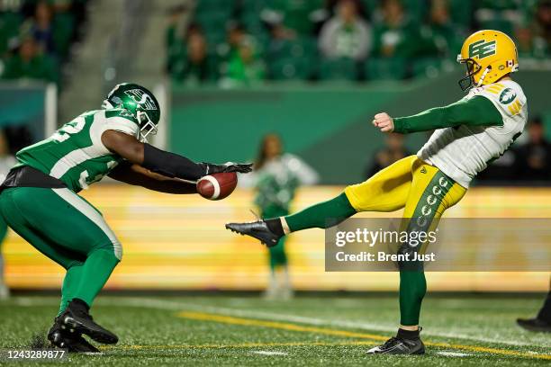 Allen of the Saskatchewan Roughriders blocks the punt of Jon Ryan of the Edmonton Elks in the game between the Edmonton Elks and Saskatchewan...